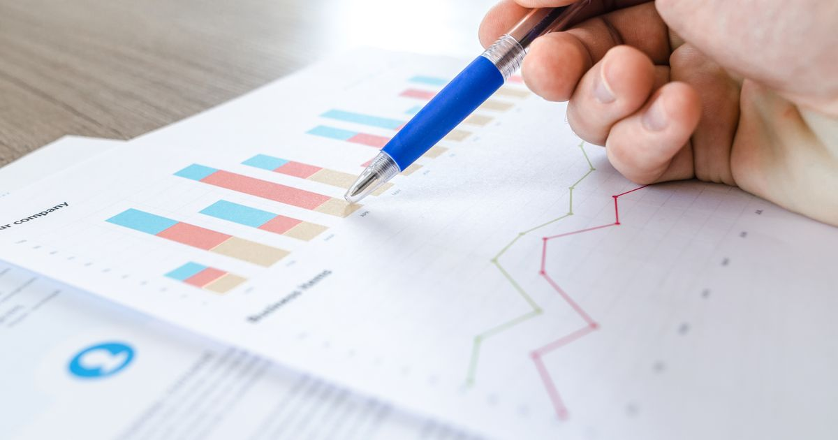 Person analyzing business performance charts