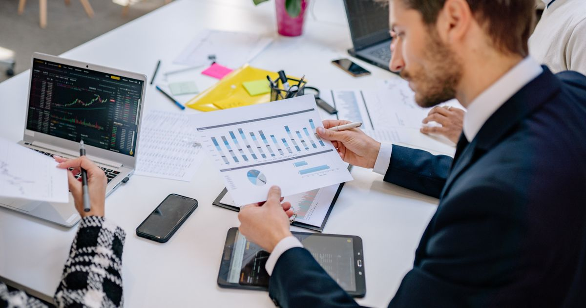 Business meeting with financial charts analysis