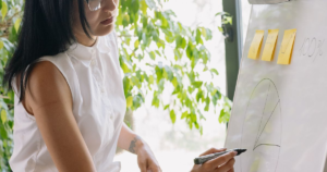 CMO responsibilities: marketing leader presenting strategy and data to her team